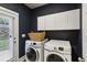 Well-organized laundry room with modern washer and dryer at 2023 Yellow Finch Trl, Atlanta, GA 30316