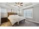 Comfortable bedroom with tray ceiling, plush carpet, and ample natural light at 2023 Yellow Finch Trl, Atlanta, GA 30316