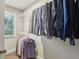 Spacious walk-in closet with ample hanging space and shelving for optimal storage and organization at 2023 Yellow Finch Trl, Atlanta, GA 30316