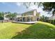 Expansive backyard featuring a spacious patio, lush green lawn, and a wood fence, perfect for outdoor entertaining and relaxation at 3362 Palm Nw Cir, Kennesaw, GA 30144