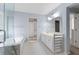 Bathroom featuring double sinks, walk-in shower, and large mirror at 3362 Palm Nw Cir, Kennesaw, GA 30144