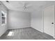 Bright bedroom with neutral walls, carpet flooring, a ceiling fan, and a window at 3362 Palm Nw Cir, Kennesaw, GA 30144