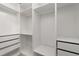 Walk-in closet with custom shelving and drawers for organization at 3362 Palm Nw Cir, Kennesaw, GA 30144
