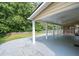Enjoy outdoor living under this large covered patio with ceiling fans and stylish concrete flooring at 3362 Palm Nw Cir, Kennesaw, GA 30144