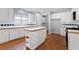 Bright kitchen boasts an island, stainless steel appliances, and a tiled backsplash at 3362 Palm Nw Cir, Kennesaw, GA 30144