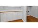 Laundry room showcases plenty of cabinets and hardwood floors at 3362 Palm Nw Cir, Kennesaw, GA 30144