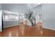 Open-concept living room view to staircase and white kitchen with breakfast bar and backsplash at 3362 Palm Nw Cir, Kennesaw, GA 30144