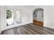 Bright living room boasts beautiful flooring, French doors and an arched entryway at 3362 Palm Nw Cir, Kennesaw, GA 30144