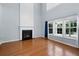 Spacious living room features a fireplace, hardwood floors, and plenty of natural light at 3362 Palm Nw Cir, Kennesaw, GA 30144
