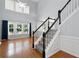 Inviting living room showcases a soaring ceiling, hardwood floors, and an elegant staircase at 3362 Palm Nw Cir, Kennesaw, GA 30144