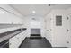 Bright kitchen with stone countertops, ample storage, and seamless access to the rest of the house at 5490 Chemin De Vie, Sandy Springs, GA 30342
