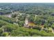 Stunning aerial view of a home nestled among trees, with waterfront access on a winding river at 55 Rocky Ne Cir, White, GA 30184