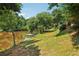 Picturesque waterfront backyard with mature trees offering shade and a serene setting at 55 Rocky Ne Cir, White, GA 30184