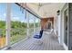 Covered outdoor patio featuring outdoor seating and a relaxing swing at 55 Rocky Ne Cir, White, GA 30184
