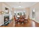 Bright dining area features hardwood floors, fireplace and natural light through a bay window at 55 Rocky Ne Cir, White, GA 30184