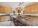 Bright kitchen features stainless steel appliances, granite countertops, and a convenient center island with cooktop at 55 Rocky Ne Cir, White, GA 30184