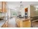 Spacious kitchen with granite countertops, tile flooring and a large center island cooktop at 55 Rocky Ne Cir, White, GA 30184