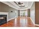 Large living room with hardwood floors, fireplace and natural light from the bay window at 55 Rocky Ne Cir, White, GA 30184