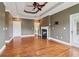 Spacious living room with a fireplace, tray ceiling and door leading to the patio at 55 Rocky Ne Cir, White, GA 30184