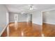 Expansive living room features hardwood flooring and large windows, filling the room with natural light at 55 Rocky Ne Cir, White, GA 30184