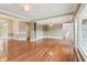 Large, open living space featuring hardwood floors, recessed lighting, and a chandelier at 55 Rocky Ne Cir, White, GA 30184