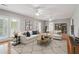 Comfortable living room with ample seating, hardwood floors, and natural light at 55 Rocky Ne Cir, White, GA 30184