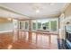 Bright living room offering large windows, a fireplace, and access to a deck at 55 Rocky Ne Cir, White, GA 30184