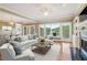 Bright living room offering large windows, a fireplace, and access to a deck at 55 Rocky Ne Cir, White, GA 30184
