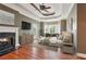 Spacious main bedroom with fireplace, tray ceiling, and access to an outdoor balcony at 55 Rocky Ne Cir, White, GA 30184