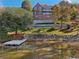A tranquil waterfront home with a dock, offering stunning water views and access at 55 Rocky Ne Cir, White, GA 30184