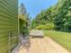 Cozy back patio with outdoor seating, perfect for enjoying the backyard's serene atmosphere at 10 Stewart Hollow Ln, Covington, GA 30016