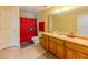 Bathroom with a large vanity, tile floor, and a shower featuring a Georgia Bulldogs-themed curtain at 10 Stewart Hollow Ln, Covington, GA 30016