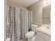 Bathroom featuring a shower-tub combo with decorative curtain and single sink vanity at 10 Stewart Hollow Ln, Covington, GA 30016