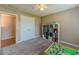 Neutral bedroom featuring a large closet, neutral carpet, and bright lighting at 10 Stewart Hollow Ln, Covington, GA 30016