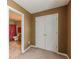 Bedroom featuring neutral carpet, fresh paint, and a closet for ample storage at 10 Stewart Hollow Ln, Covington, GA 30016
