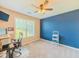Well-lit bedroom with light-colored walls, carpet, a ceiling fan, and a large window at 10 Stewart Hollow Ln, Covington, GA 30016
