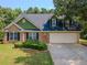 Charming brick home with a well-manicured lawn and a two-car garage at 10 Stewart Hollow Ln, Covington, GA 30016