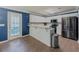 Bright kitchen features stainless steel appliances, white cabinetry, and bar seating, leading to a sunny outdoor view at 10 Stewart Hollow Ln, Covington, GA 30016