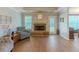 Living room showcasing the brick fireplace and hardwood flooring at 10 Stewart Hollow Ln, Covington, GA 30016
