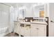 Bathroom features double vanities and sink, a shower and bathtub with a curtain at 1310 Chilton Woods Rd, Rutledge, GA 30663