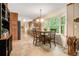 Eat-in kitchen features wooden cabinets, a breakfast table by the window, and modern appliances at 1310 Chilton Woods Rd, Rutledge, GA 30663
