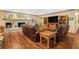 Inviting living room with hardwood flooring, a brick fireplace, and comfortable seating at 1310 Chilton Woods Rd, Rutledge, GA 30663