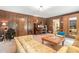Spacious living room features a cozy sitting area and a built-in bookshelf at 1310 Chilton Woods Rd, Rutledge, GA 30663