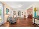 Elegant living room showcasing wood floors, neutral walls, and comfortable seating arrangement at 1310 Chilton Woods Rd, Rutledge, GA 30663