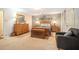 Cozy main bedroom features neutral tones, a ceiling fan, and a wood dresser with large mirror at 1310 Chilton Woods Rd, Rutledge, GA 30663