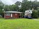 Charming brick home with a well-manicured lawn and convenient carport at 2431 Crestview Ave, Decatur, GA 30032