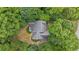 Wooded lot featuring a private backyard and a home with a well-maintained roof at 2722 Brookhaven Ln, Buford, GA 30518