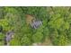 Aerial view of a home surrounded by lush green trees at 2722 Brookhaven Ln, Buford, GA 30518