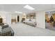 Basement featuring carpet, furniture, shelves, and a peek into another room at 2722 Brookhaven Ln, Buford, GA 30518