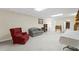 Finished basement featuring carpet, two chairs, a small table, and some shelves at 2722 Brookhaven Ln, Buford, GA 30518